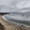 Pacific ocean waves against rocky beach/cliffs